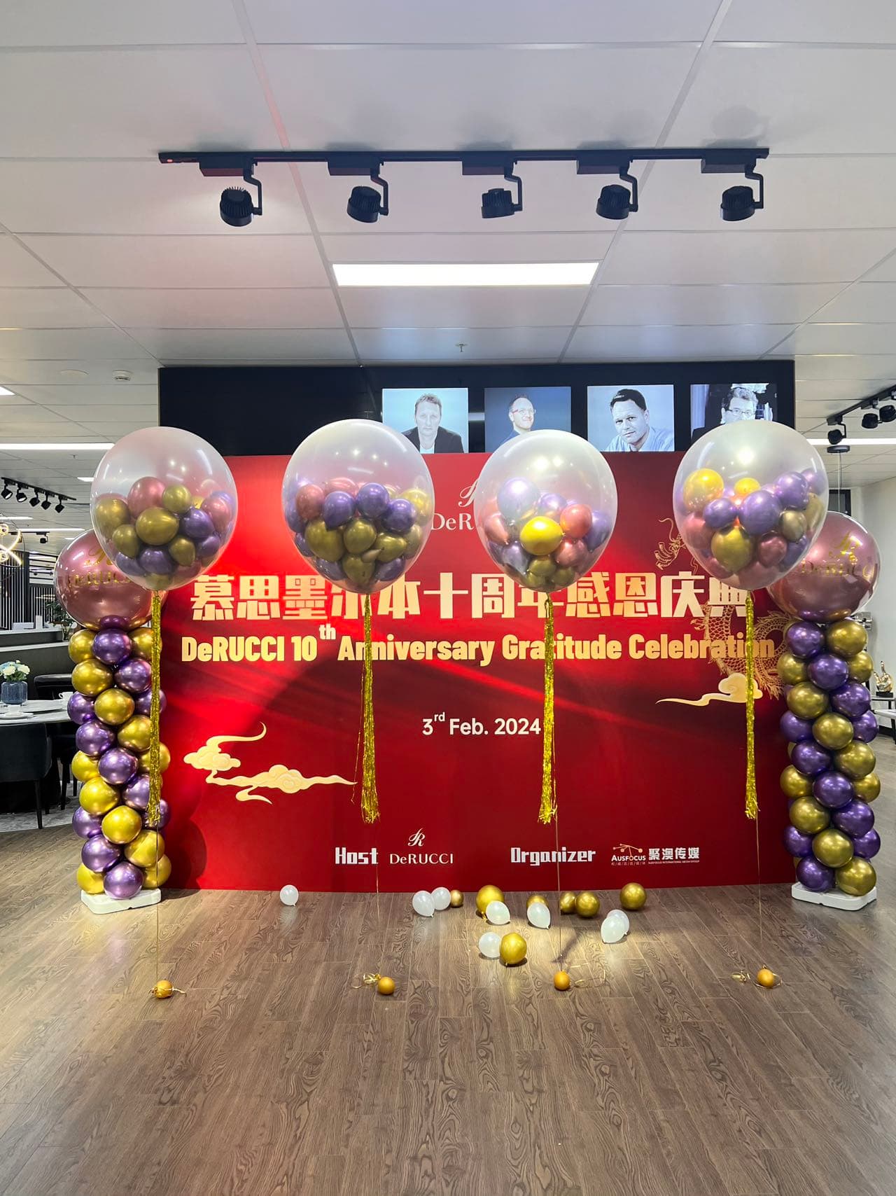 Store 10th anniversary celebration with purple and gold bubble balloon columns