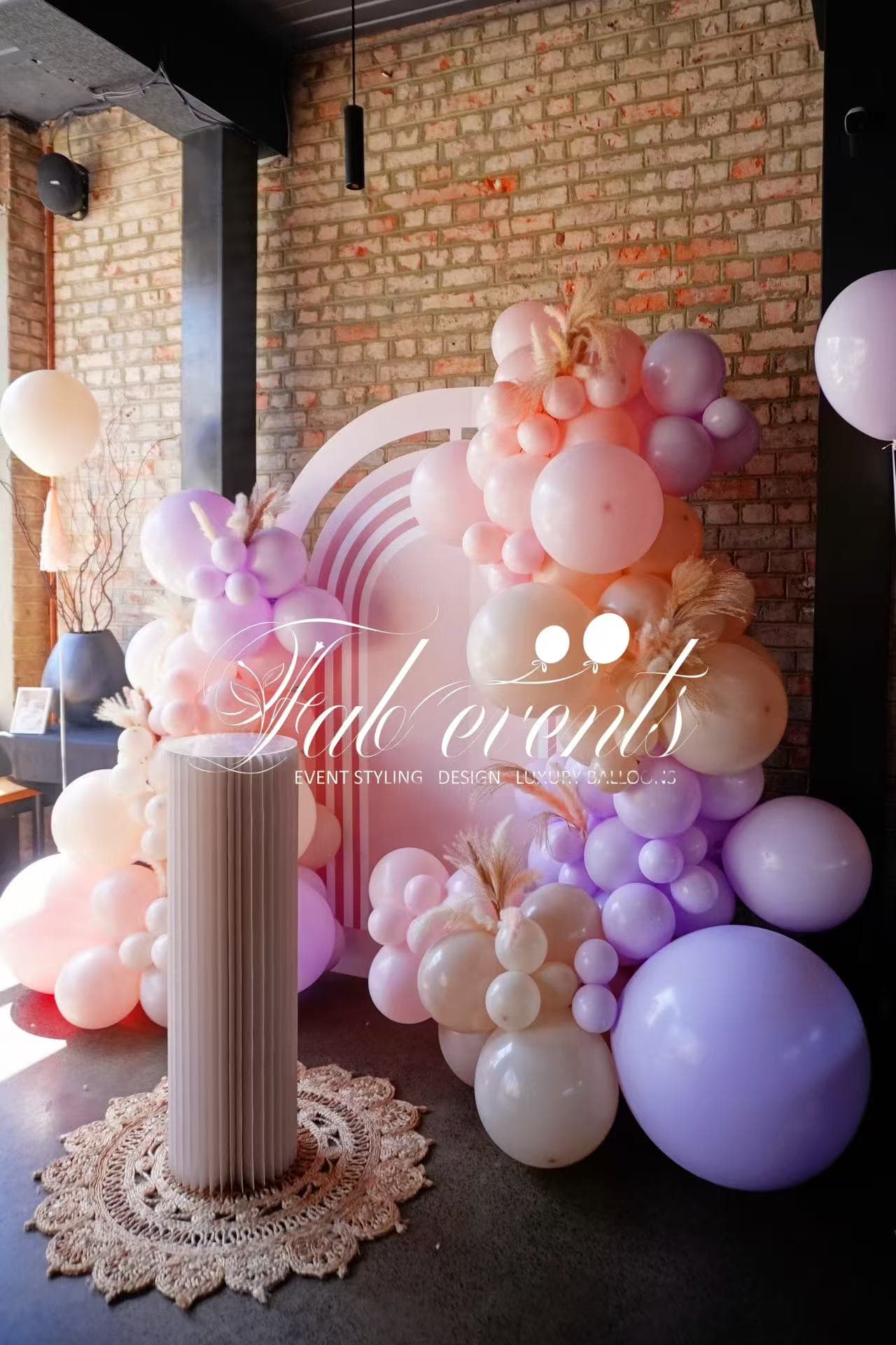 Pastel pink and purple organic balloon display