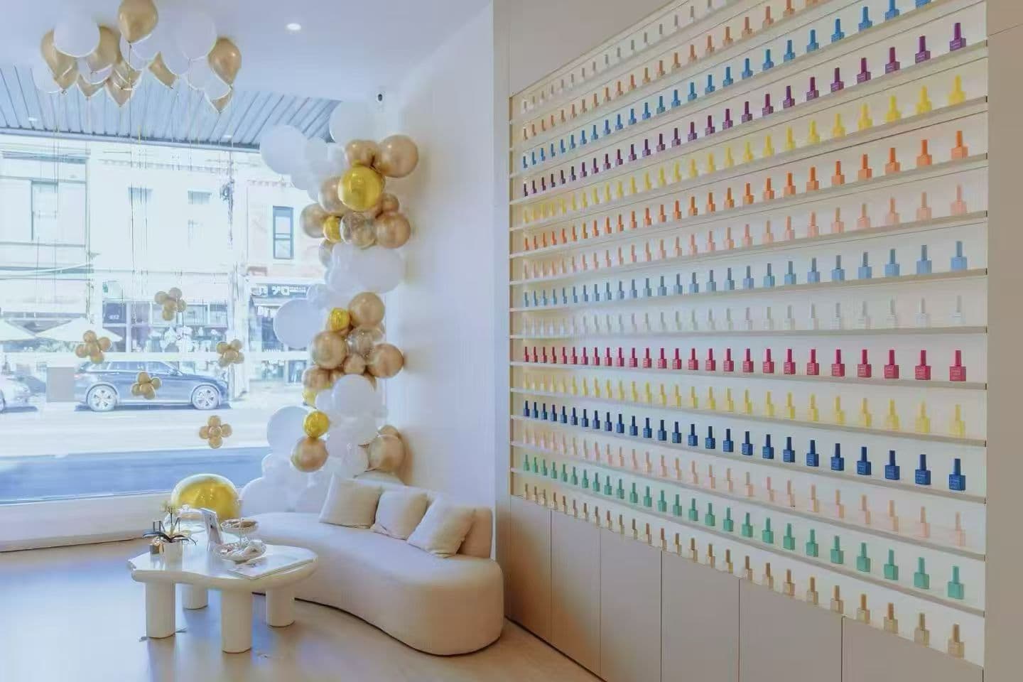 Modern minimalist lounge interior with gold and white balloon accents