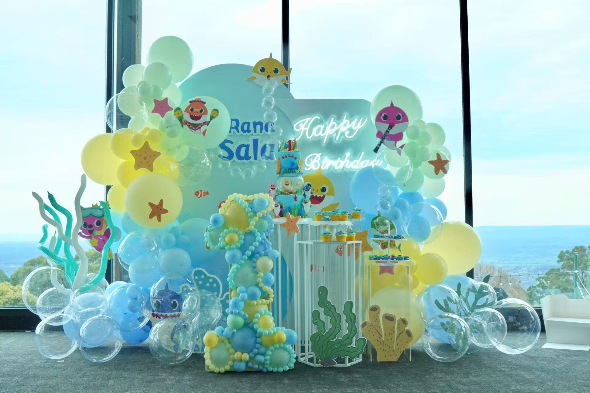 Baby Shark ocean themed 1st birthday in pastel blue and yellow.