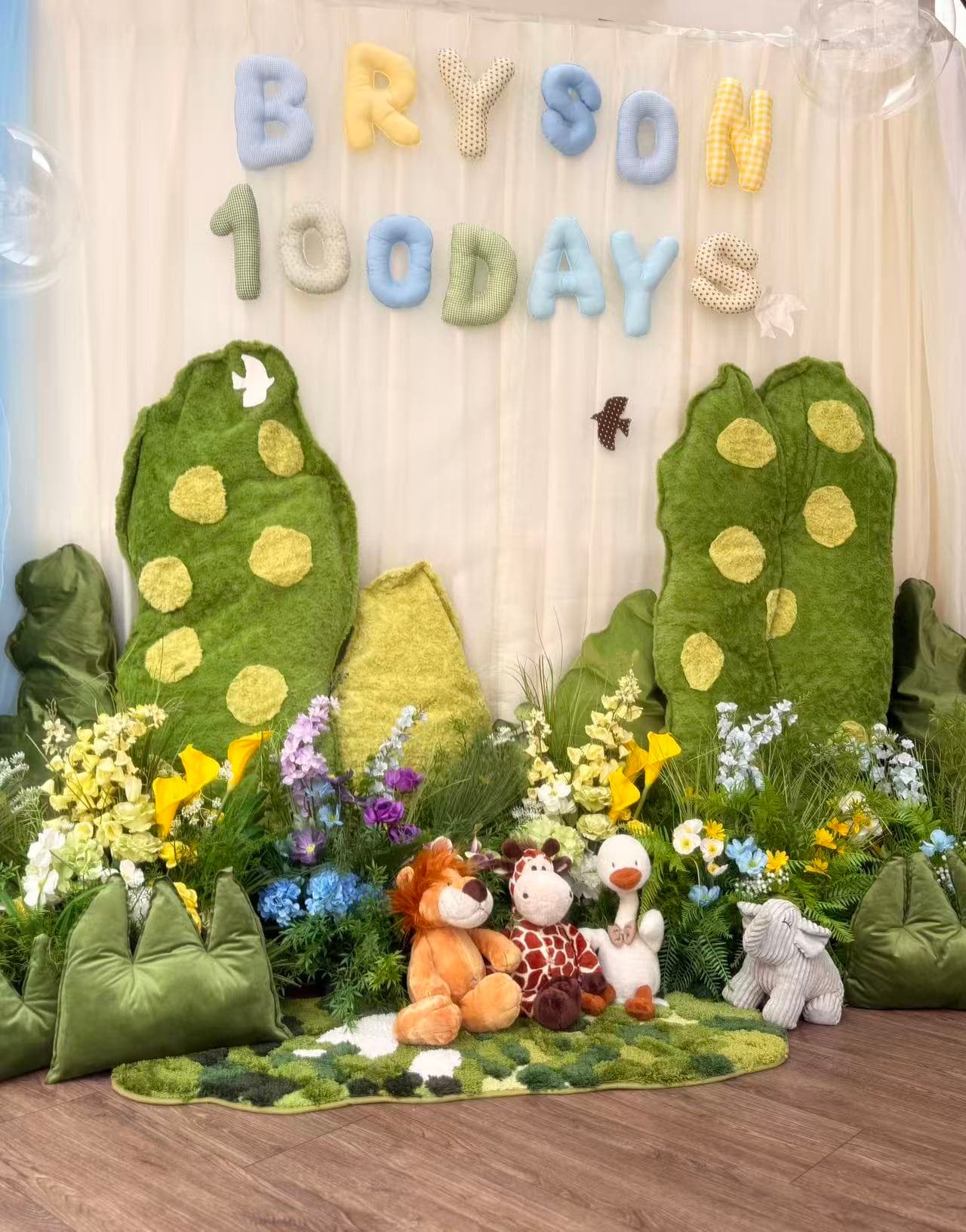 Moss garden style 100 days celebration for Bryson with plush animals.