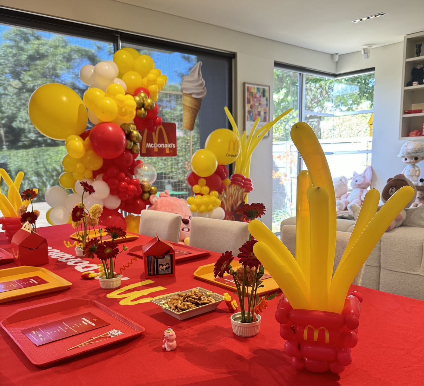 Creative McDonalds themed party decoration with red and yellow balloons