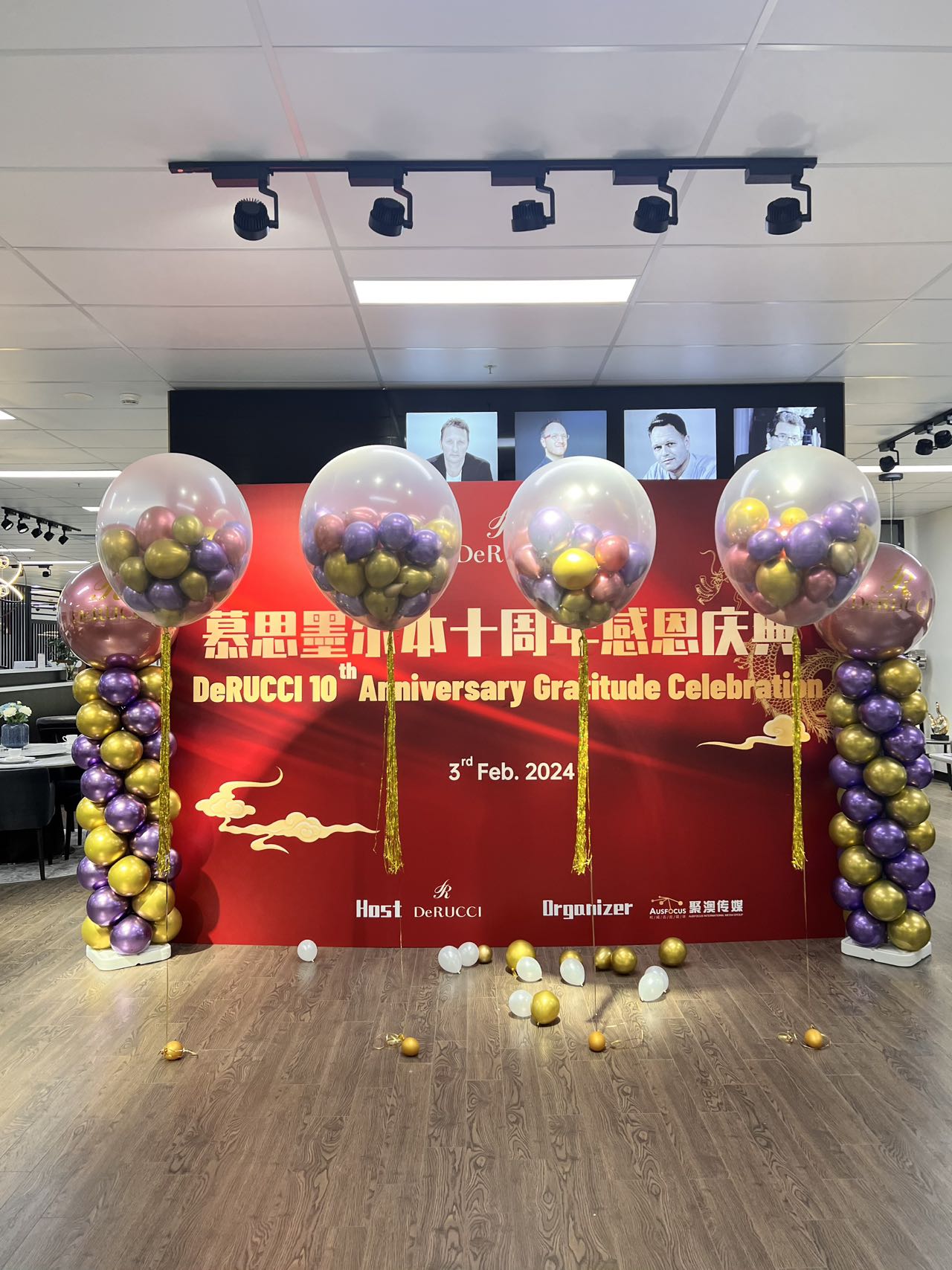 Store 10th anniversary celebration with purple and gold bubble balloon columns