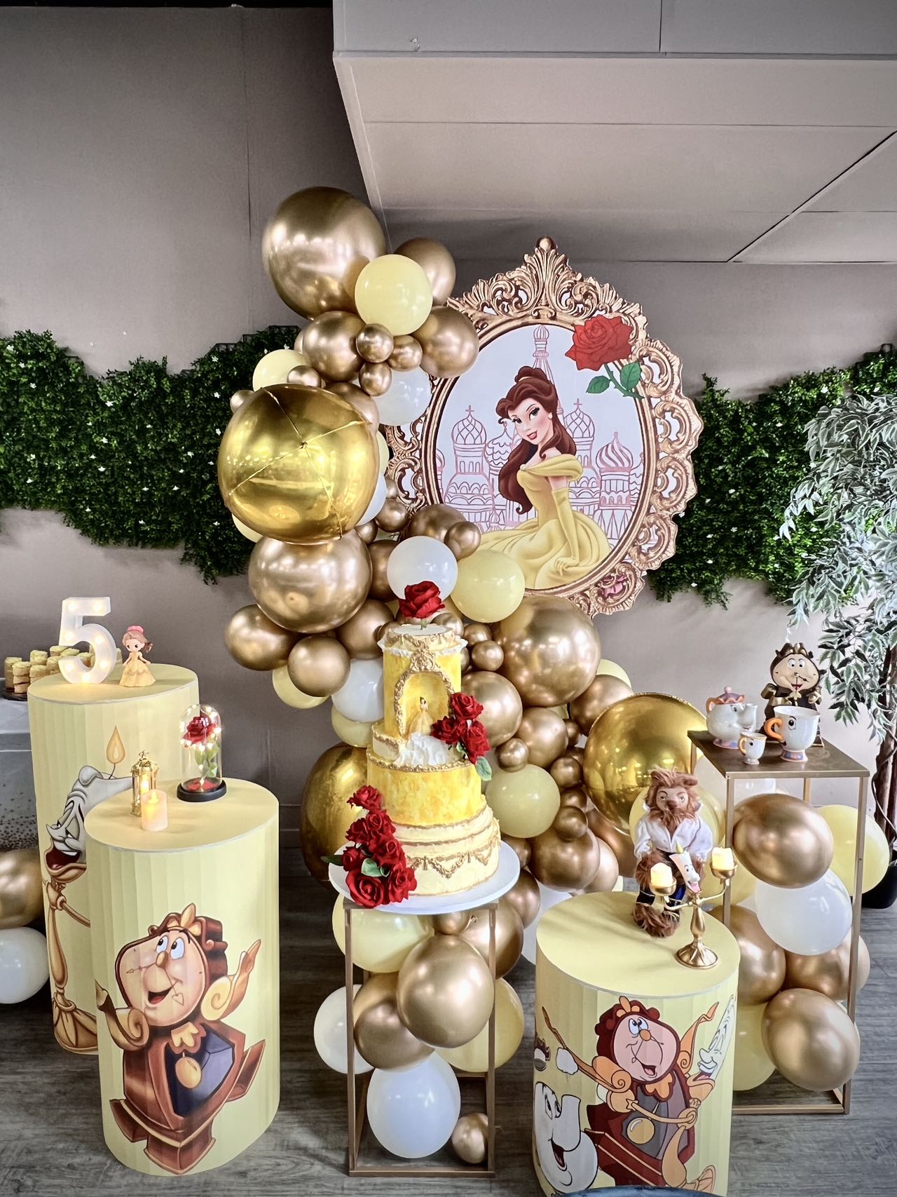 Beauty and the Beast themed 5th birthday with golden balloons and princess decor