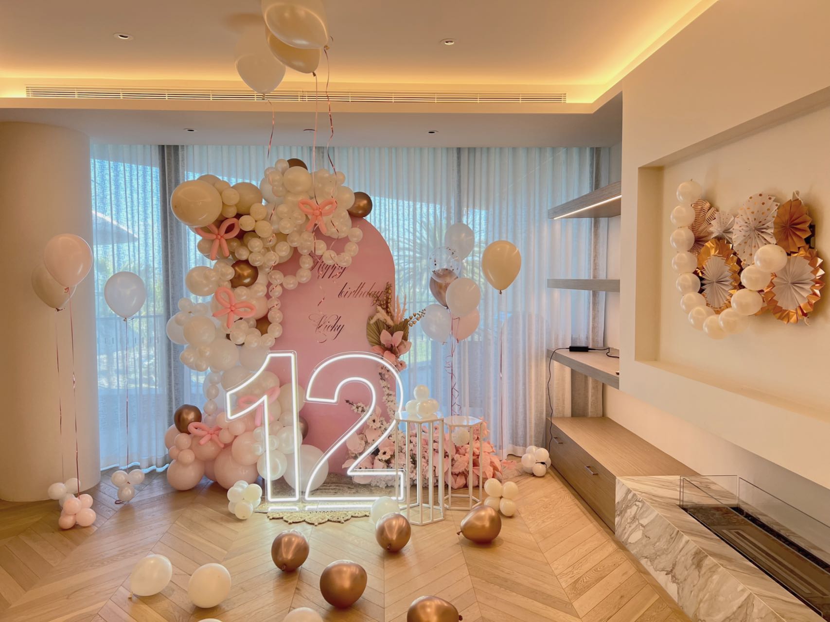 Elegant butterfly themed 12th birthday with neon lights and rose gold balloons