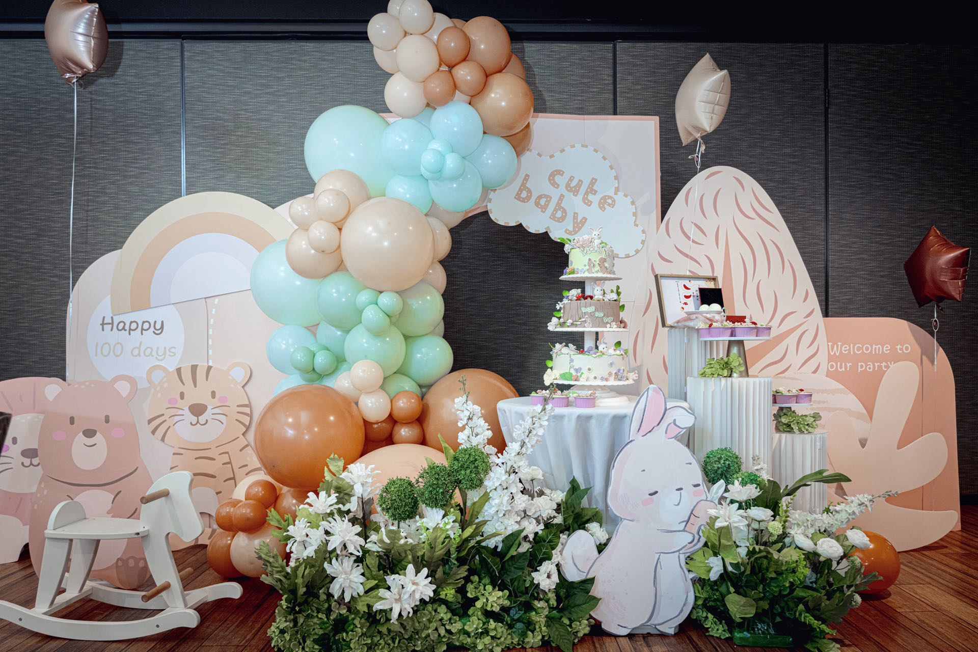 Sweet baby celebration with mint green and peach balloons featuring cute animals