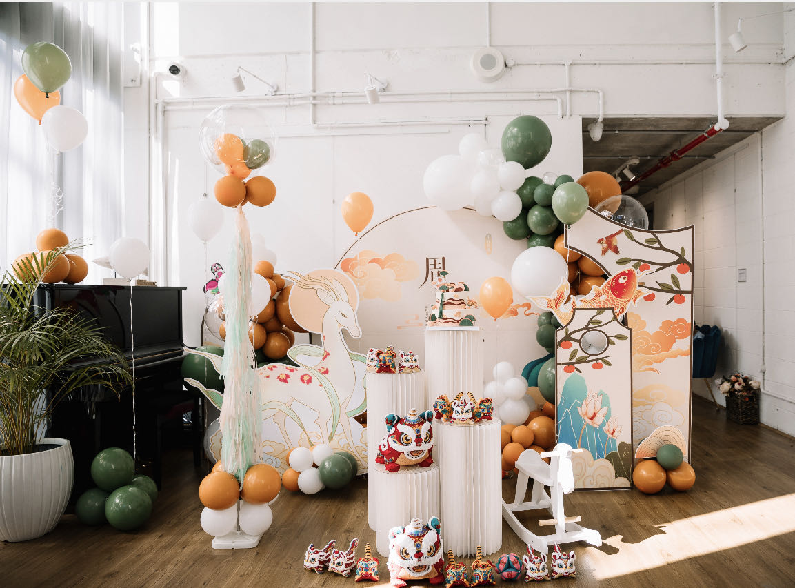 Forest animals themed party with orange and green balloon decorations