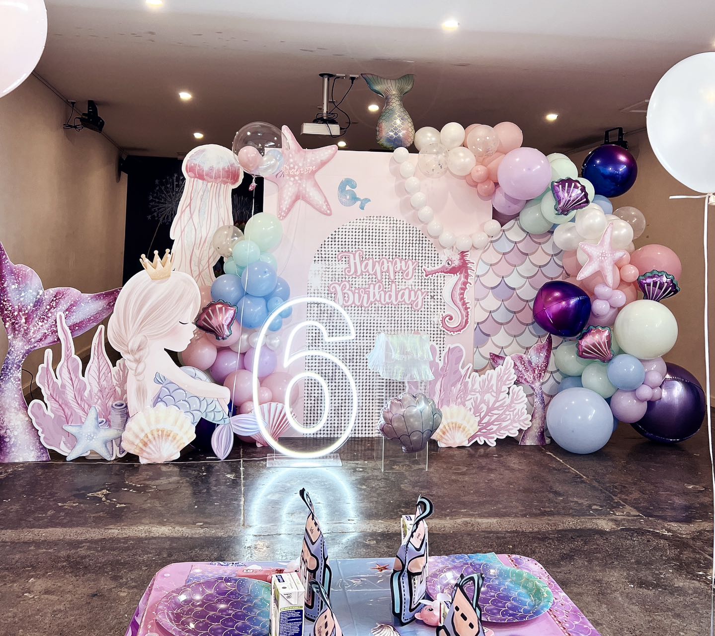 Magical mermaid themed 6th birthday with pastel pink and purple decorations