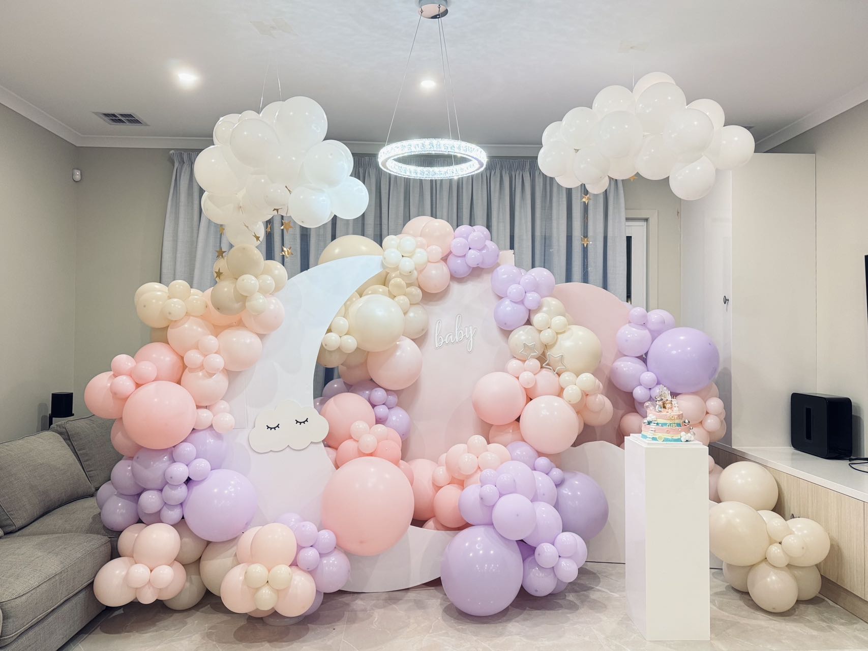 Dreamy moon and clouds theme with pastel pink and purple balloon garland