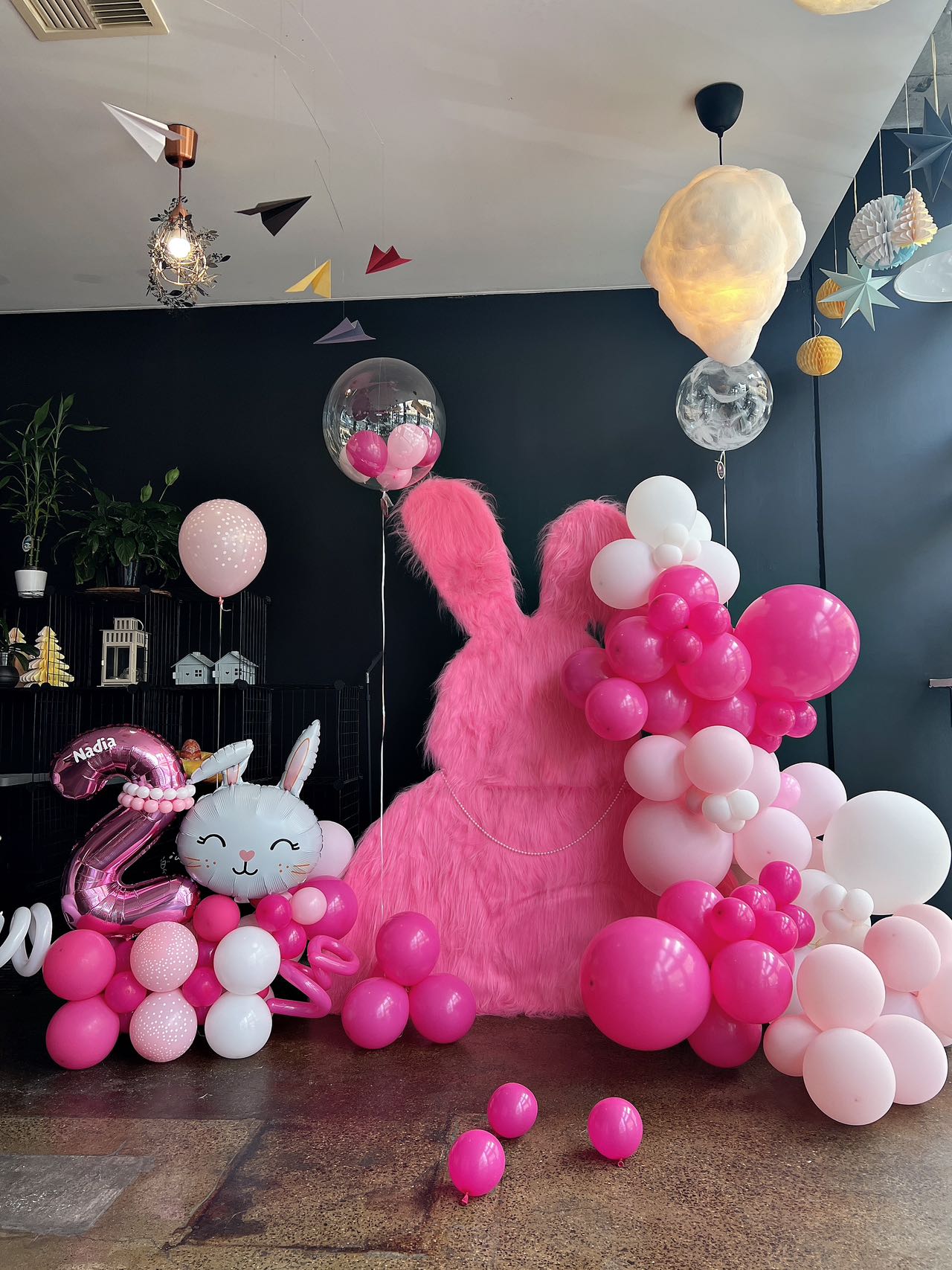 Cute pink bunny themed 2nd birthday with hot pink and white balloon decorations