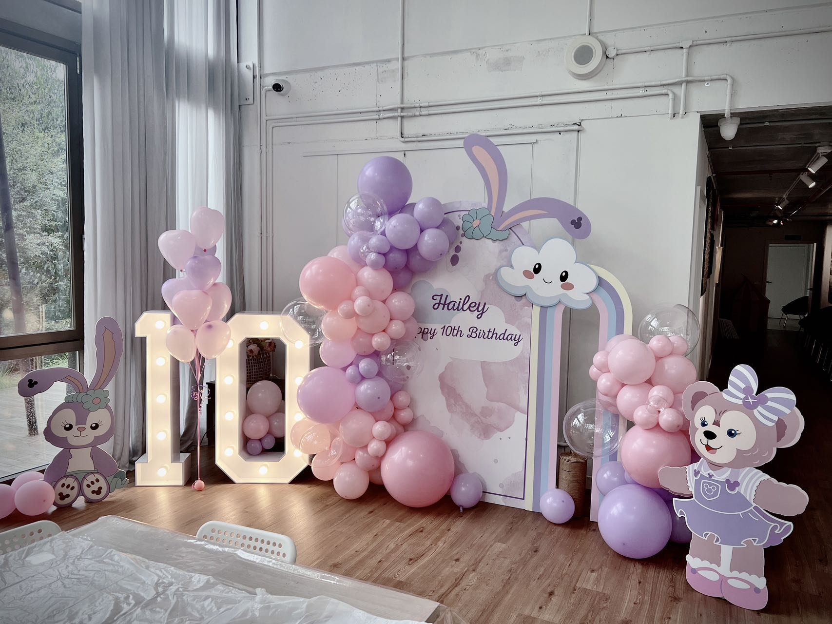 Sweet 10th birthday decoration with pink and purple balloons and bunny theme