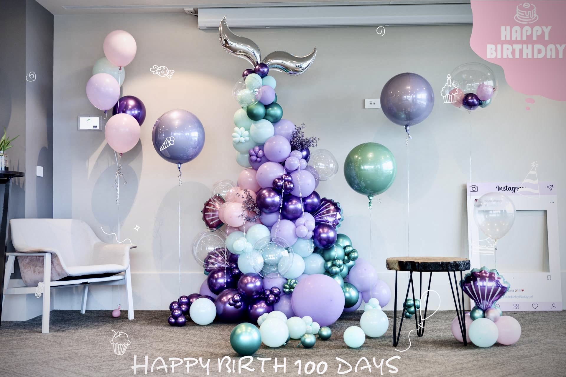 Magical 100 days celebration with purple, mint green, and pink balloons