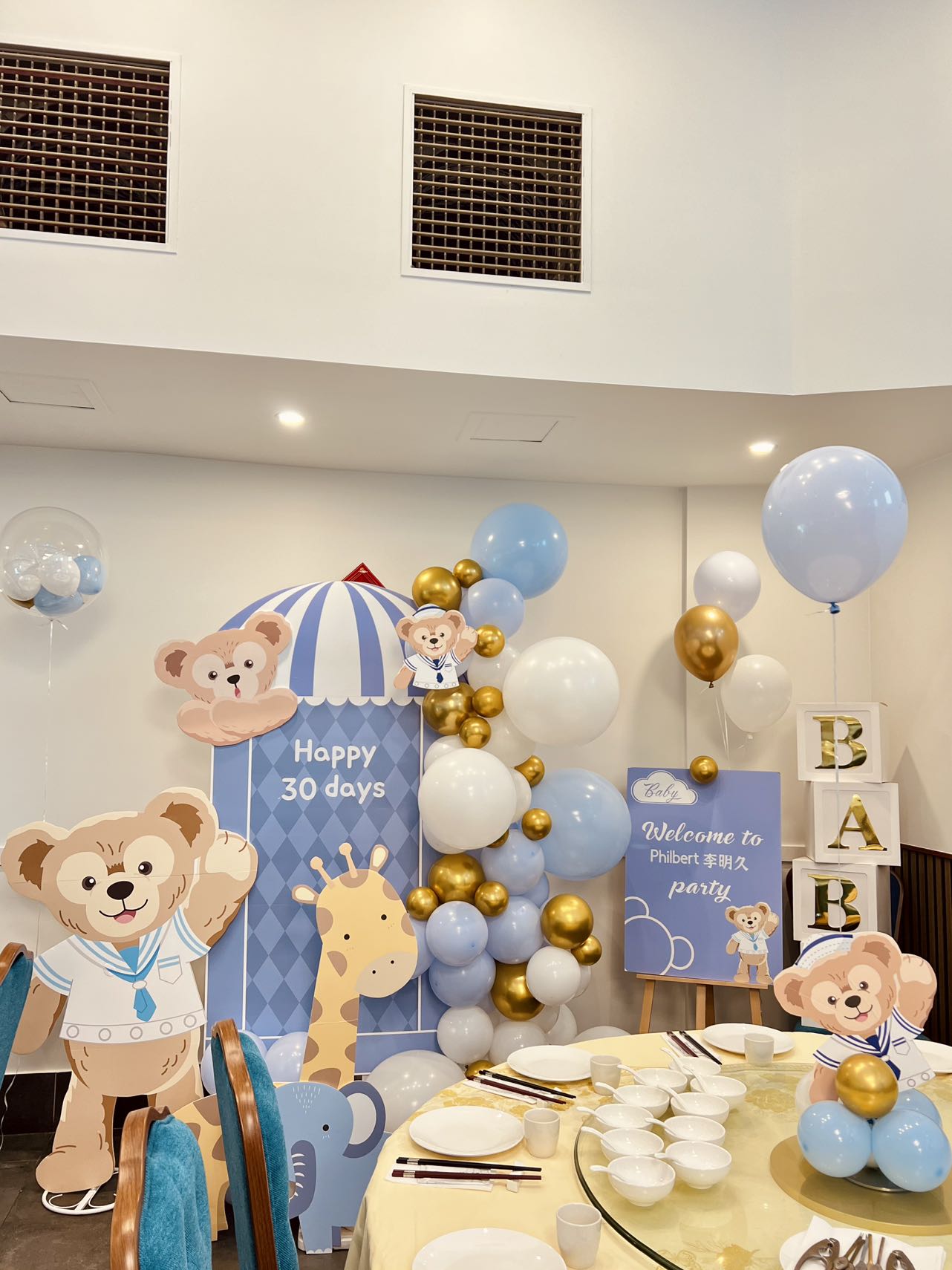 Cute teddy bear themed 30 days celebration with blue and gold balloon decorations